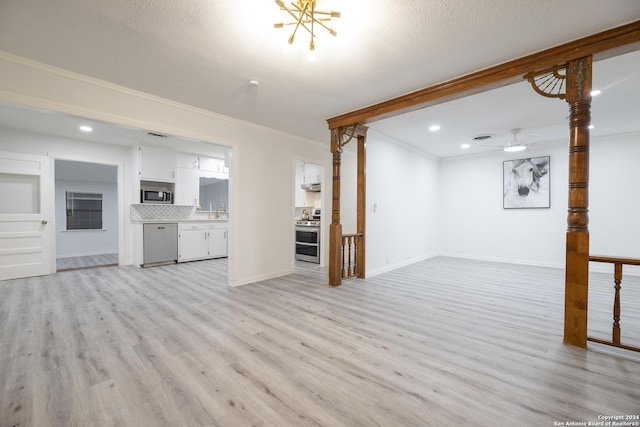 unfurnished living room featuring baseboards, ornamental molding, recessed lighting, a ceiling fan, and light wood-style floors