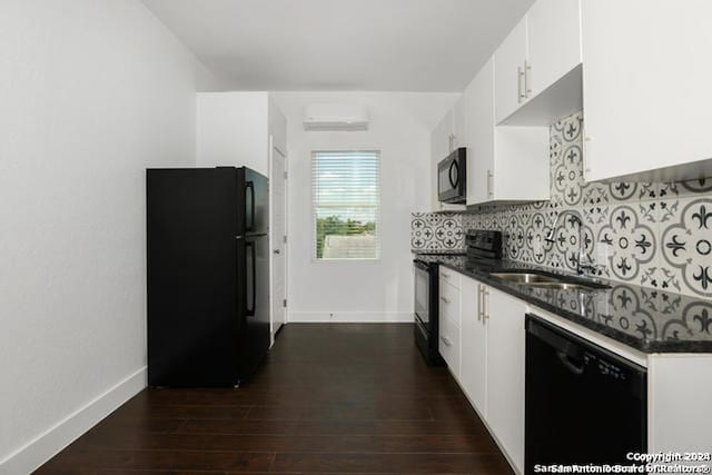 kitchen featuring white cabinets, backsplash, dark wood-type flooring, and black appliances