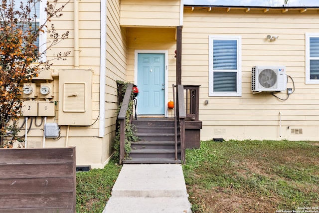 view of exterior entry featuring ac unit