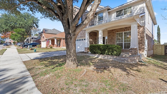 view of front of house featuring covered porch and a garage