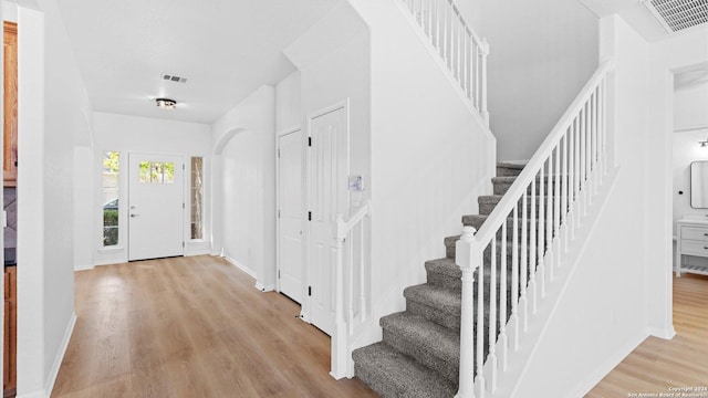 foyer entrance with light hardwood / wood-style flooring