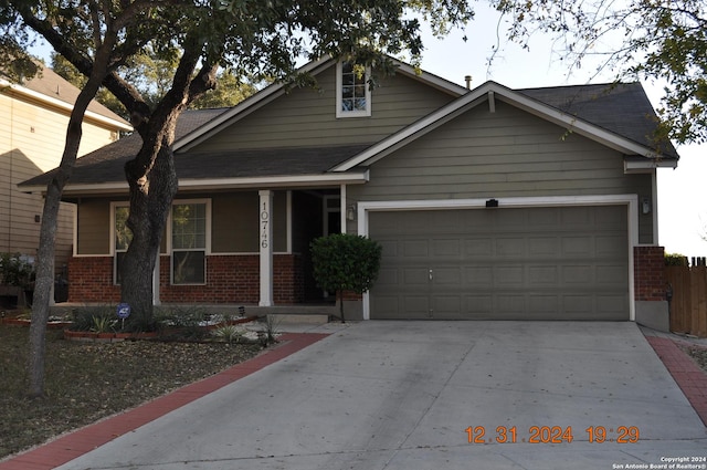 view of front of property with covered porch and a garage