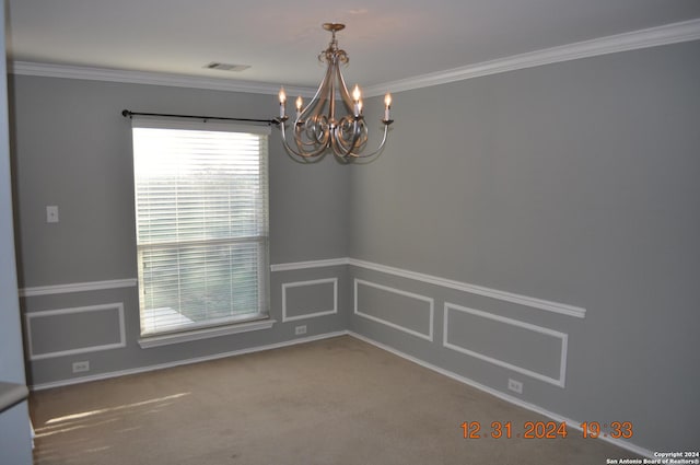 unfurnished room featuring carpet floors, a notable chandelier, and ornamental molding