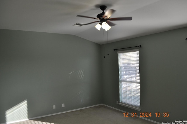 empty room with carpet, ceiling fan, and vaulted ceiling