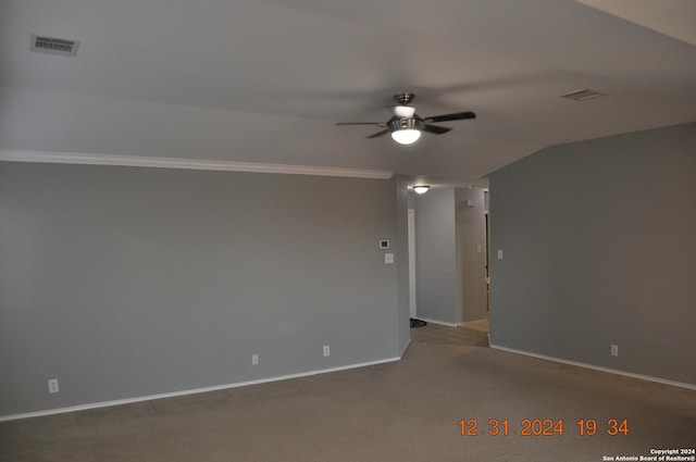 unfurnished room featuring carpet, ornamental molding, ceiling fan, and lofted ceiling