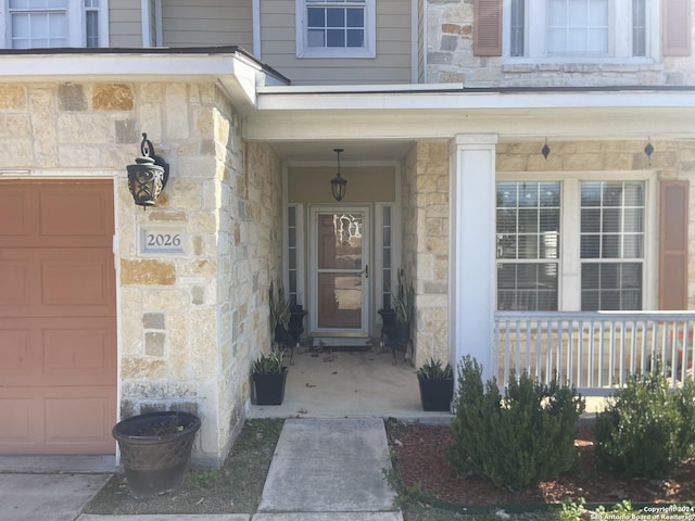 doorway to property featuring a garage