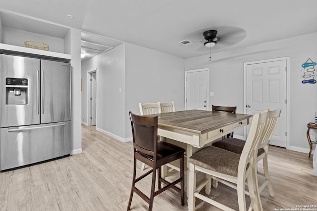 dining space featuring light hardwood / wood-style floors and ceiling fan