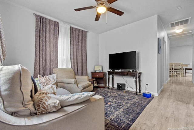 living room with ceiling fan and wood-type flooring