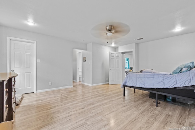 bedroom featuring light hardwood / wood-style flooring and ceiling fan