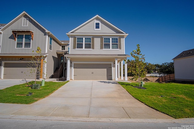 view of front facade featuring a front lawn and a garage