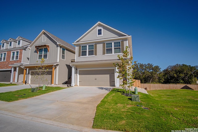 view of front facade featuring a garage and a front yard