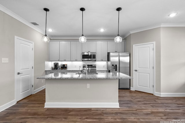 kitchen with light stone countertops, appliances with stainless steel finishes, dark hardwood / wood-style flooring, a center island with sink, and gray cabinets