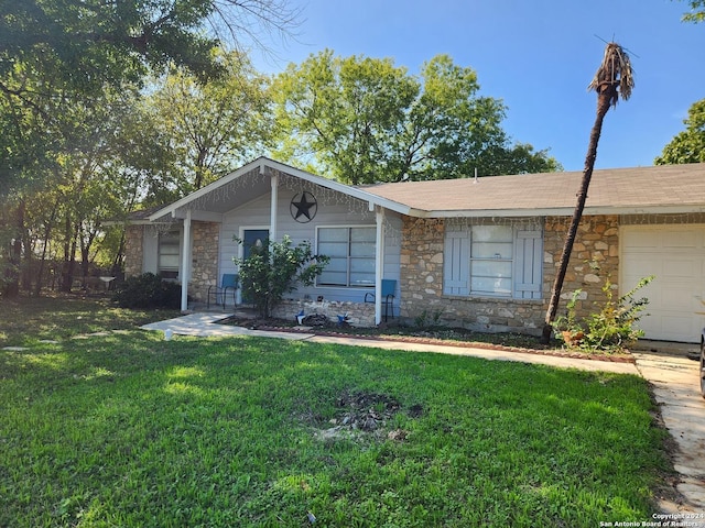 single story home featuring a garage and a front lawn