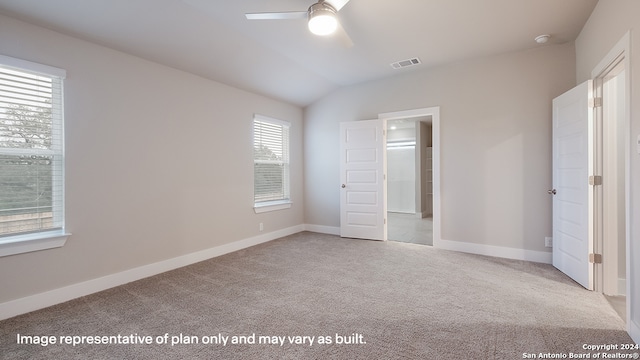 unfurnished bedroom featuring light carpet, ceiling fan, and lofted ceiling