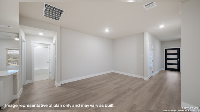 empty room with light wood-type flooring