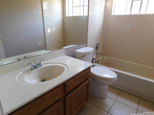 full bathroom featuring vanity, tiled shower / bath combo, tile patterned floors, and plenty of natural light