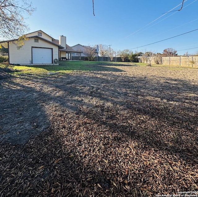 view of yard with a garage