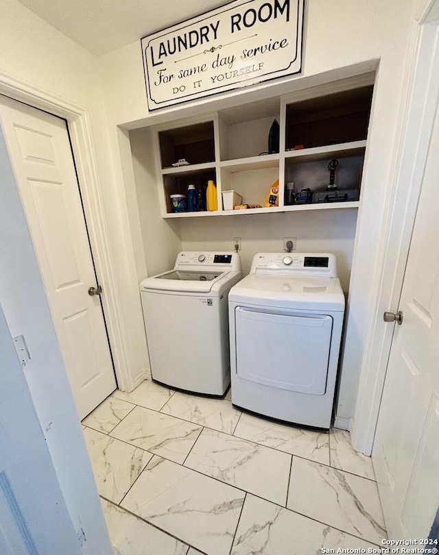 washroom with washing machine and dryer