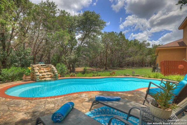 view of swimming pool featuring a patio area