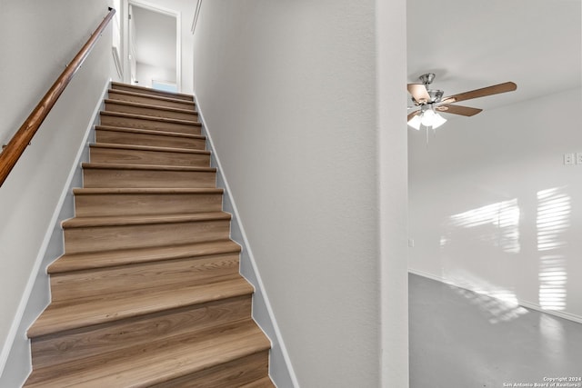 staircase with ceiling fan