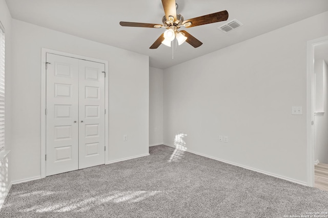 spare room with carpet flooring and ceiling fan