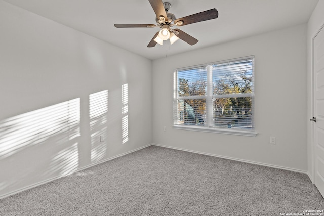 carpeted empty room with ceiling fan