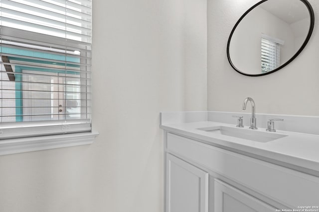 bathroom featuring vanity and plenty of natural light