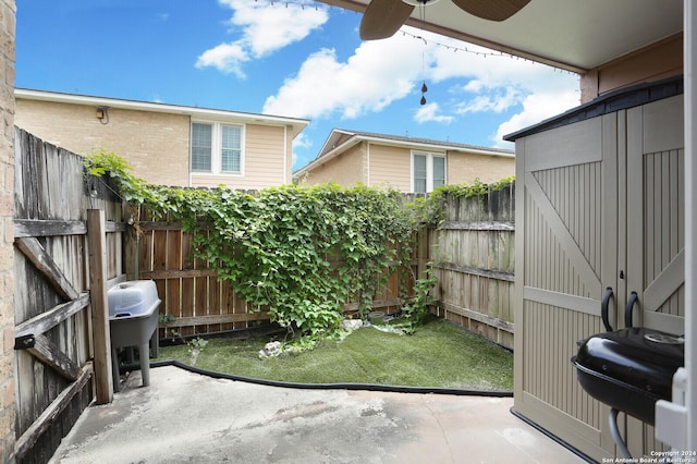 view of patio / terrace featuring a storage unit and area for grilling