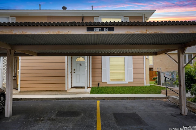 view of front of home featuring a carport