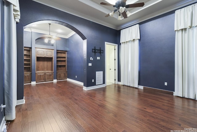 foyer with ceiling fan, dark wood-type flooring, and ornamental molding