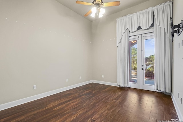 spare room with dark hardwood / wood-style floors and ceiling fan