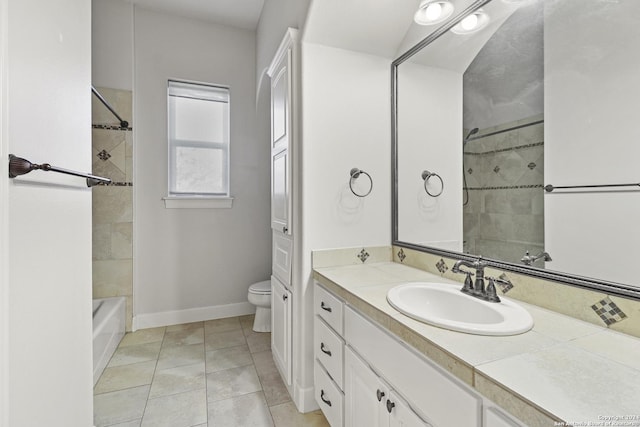 full bathroom featuring tile patterned floors, vanity, tiled shower / bath combo, and toilet