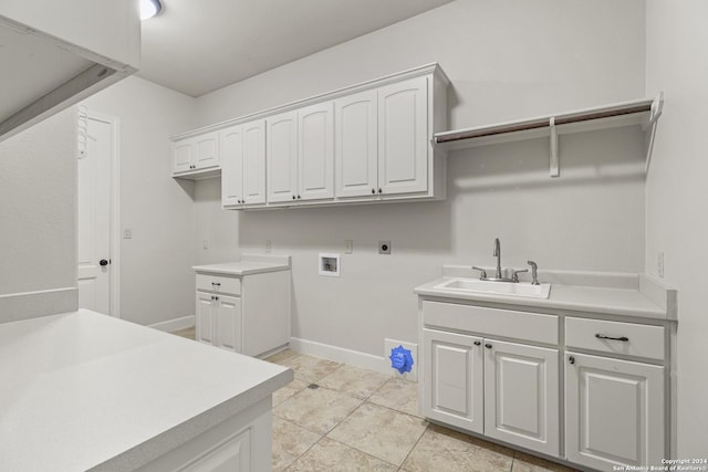 washroom featuring cabinets, washer hookup, electric dryer hookup, sink, and light tile patterned floors