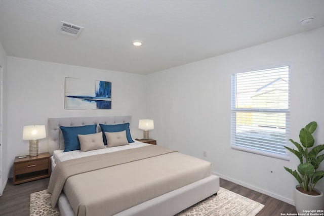 bedroom featuring dark hardwood / wood-style flooring