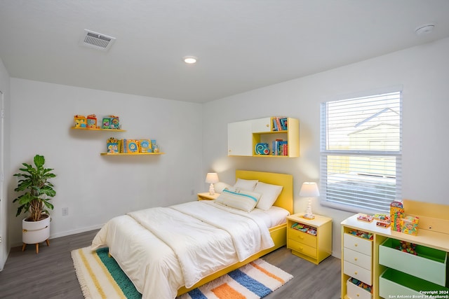 bedroom featuring hardwood / wood-style flooring