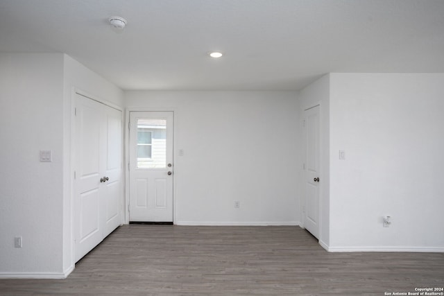 unfurnished room featuring hardwood / wood-style flooring