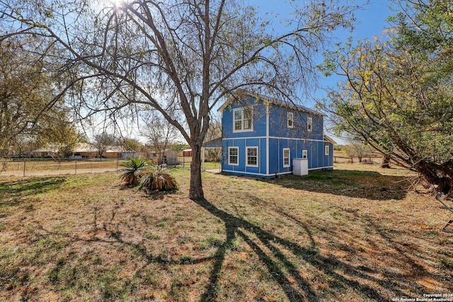 view of home's exterior featuring a lawn