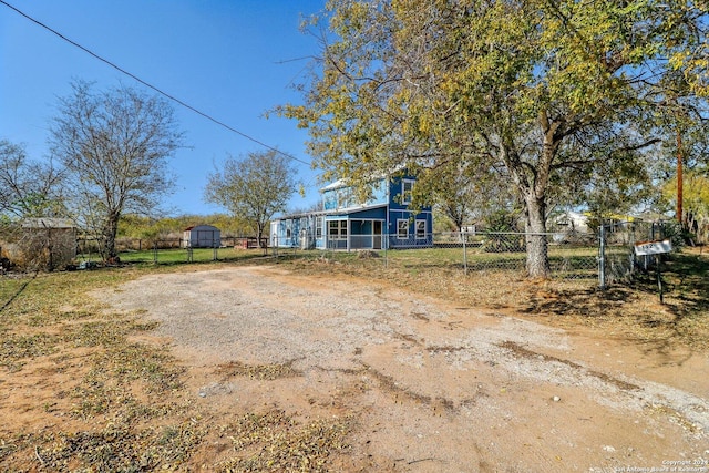 view of front of home with a storage unit