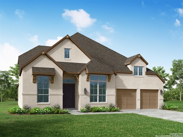 view of front of house featuring a garage and a front lawn