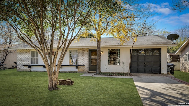 ranch-style home with a front lawn and a garage