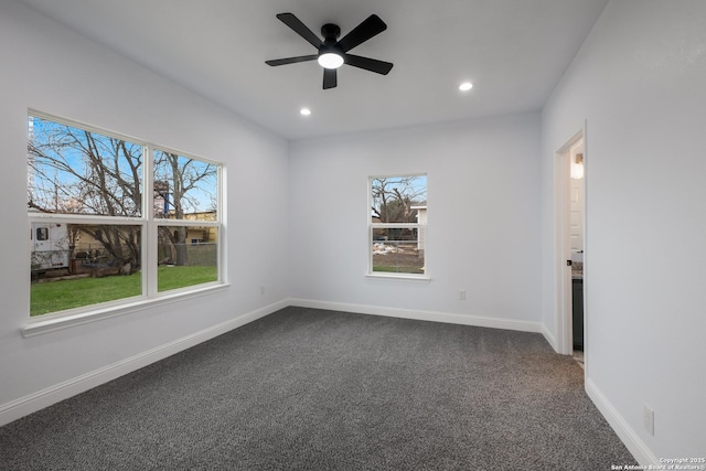 carpeted spare room with ceiling fan