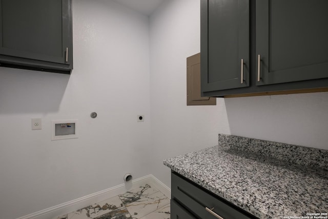 clothes washing area with cabinets, washer hookup, hookup for an electric dryer, and hookup for a gas dryer