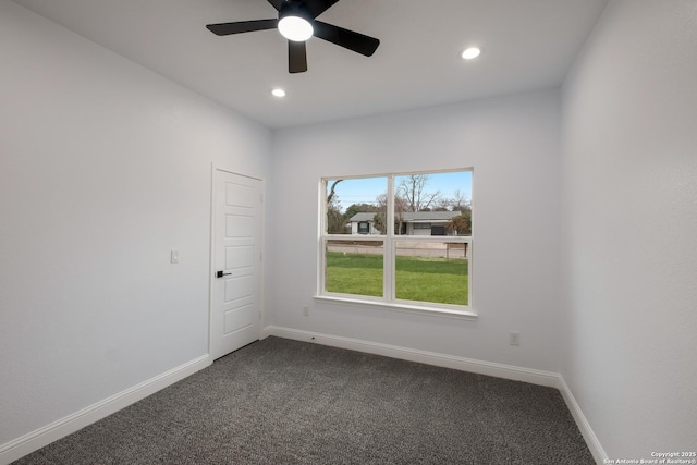 empty room with carpet floors and ceiling fan