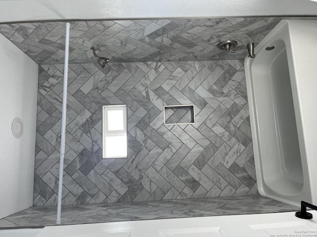 interior space featuring tiled shower