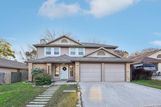 front of property with a front yard and a garage