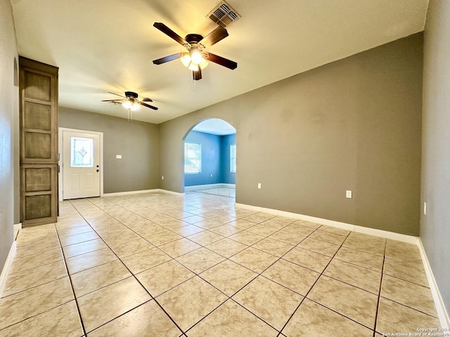 unfurnished room featuring ceiling fan and light tile patterned floors