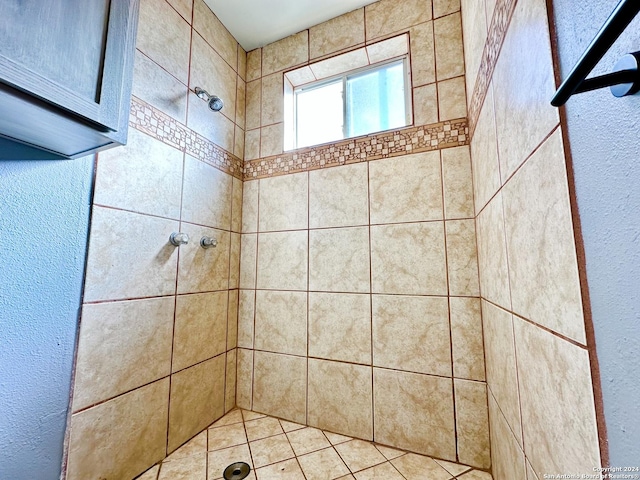 bathroom with a tile shower