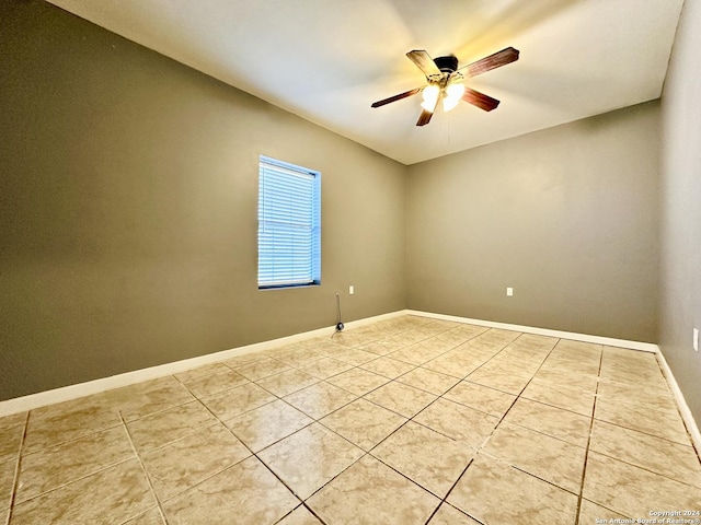 unfurnished room with light tile patterned floors and ceiling fan