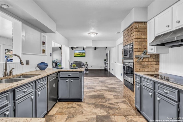 kitchen featuring sink, gray cabinetry, white cabinetry, stainless steel appliances, and kitchen peninsula