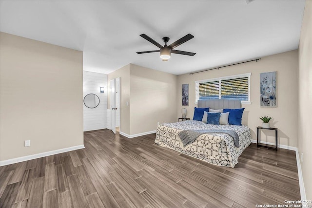 bedroom featuring ceiling fan and dark hardwood / wood-style floors